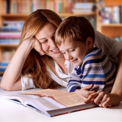 Mother reading Bible stories to her boy